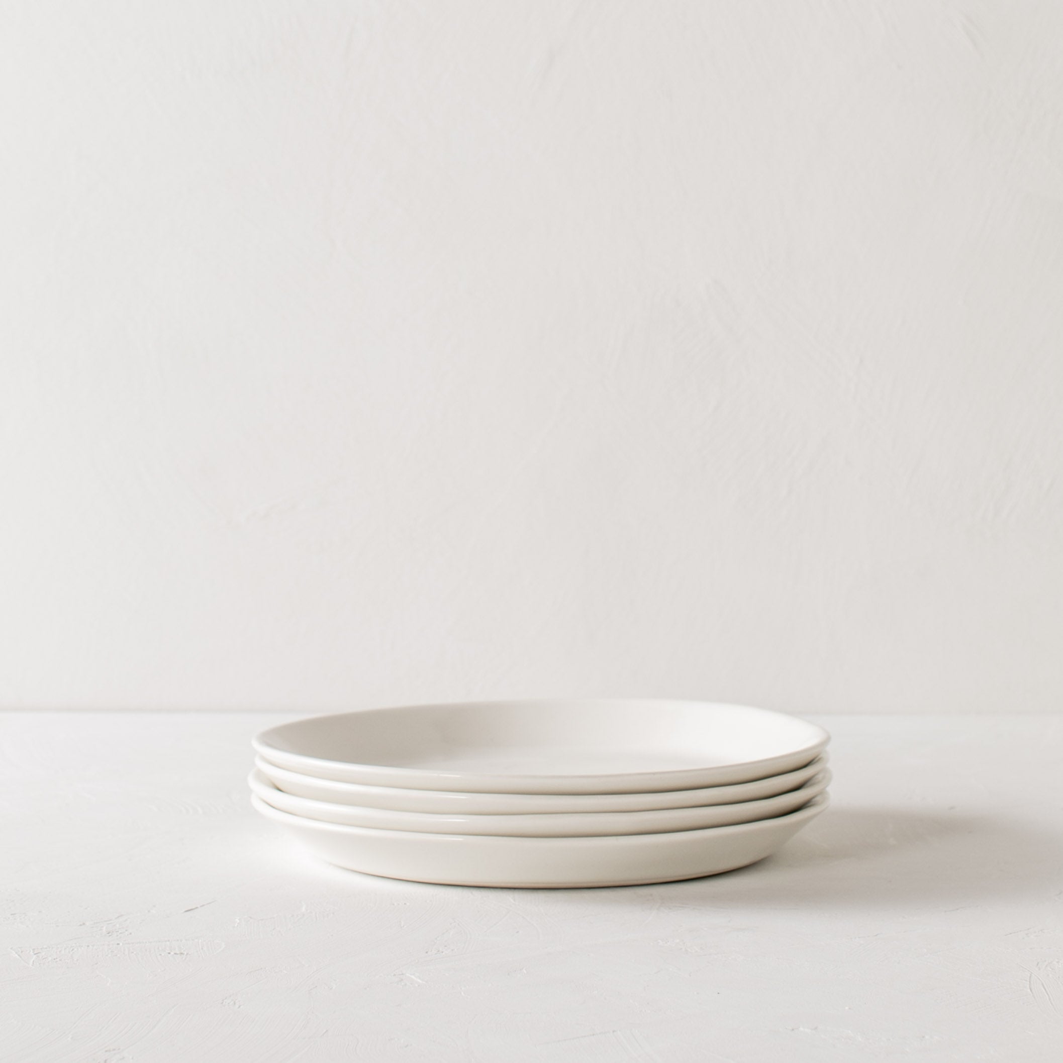 Stack of four dinner plates designed and sold by Convivial Production, Kansas City Ceramics