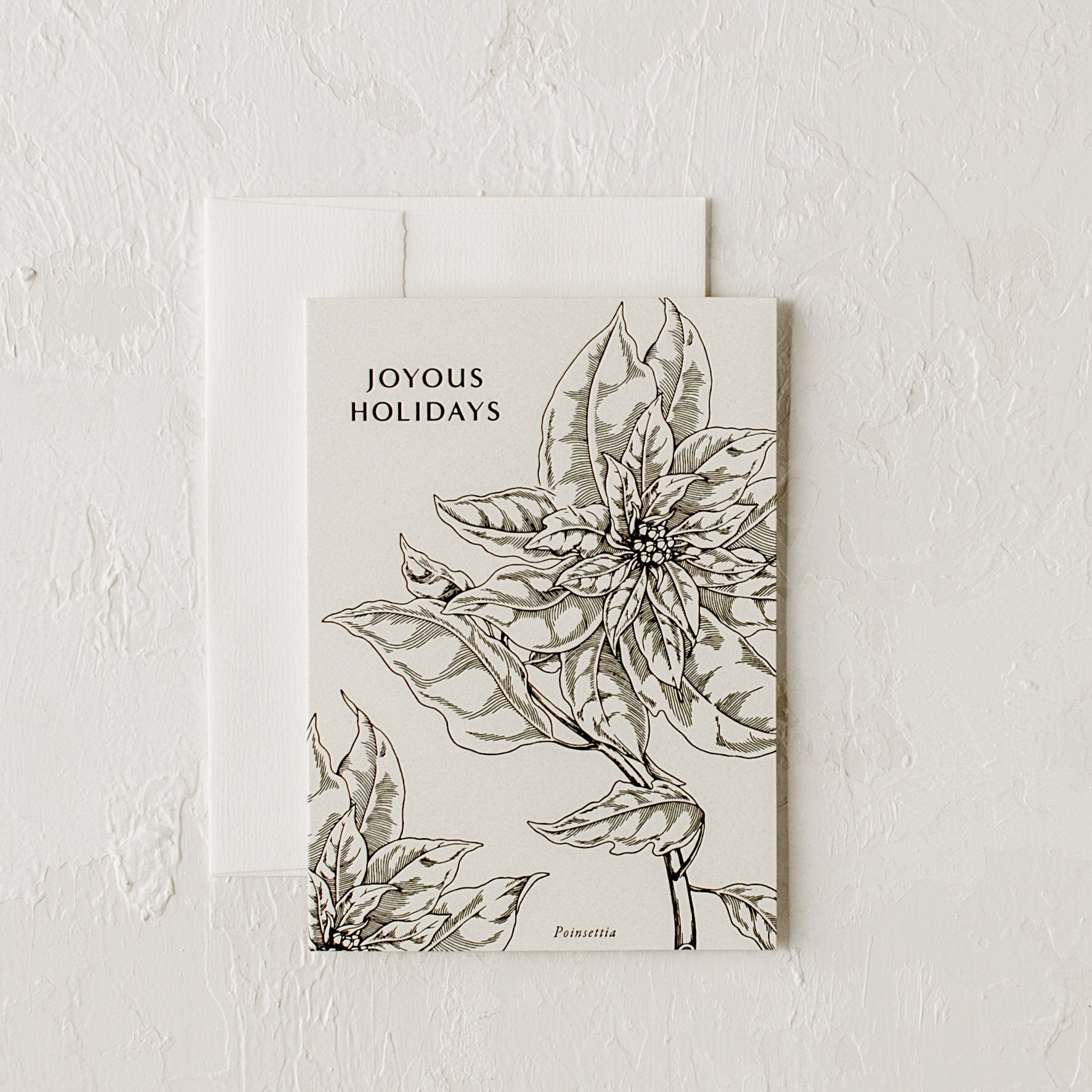 Letter-pressed holiday greeting card - "Joyous Holidays" - surrounding text is a large illustration of a poinsettia. Designed and sold by Shop Verdant, Kansas City gift store.