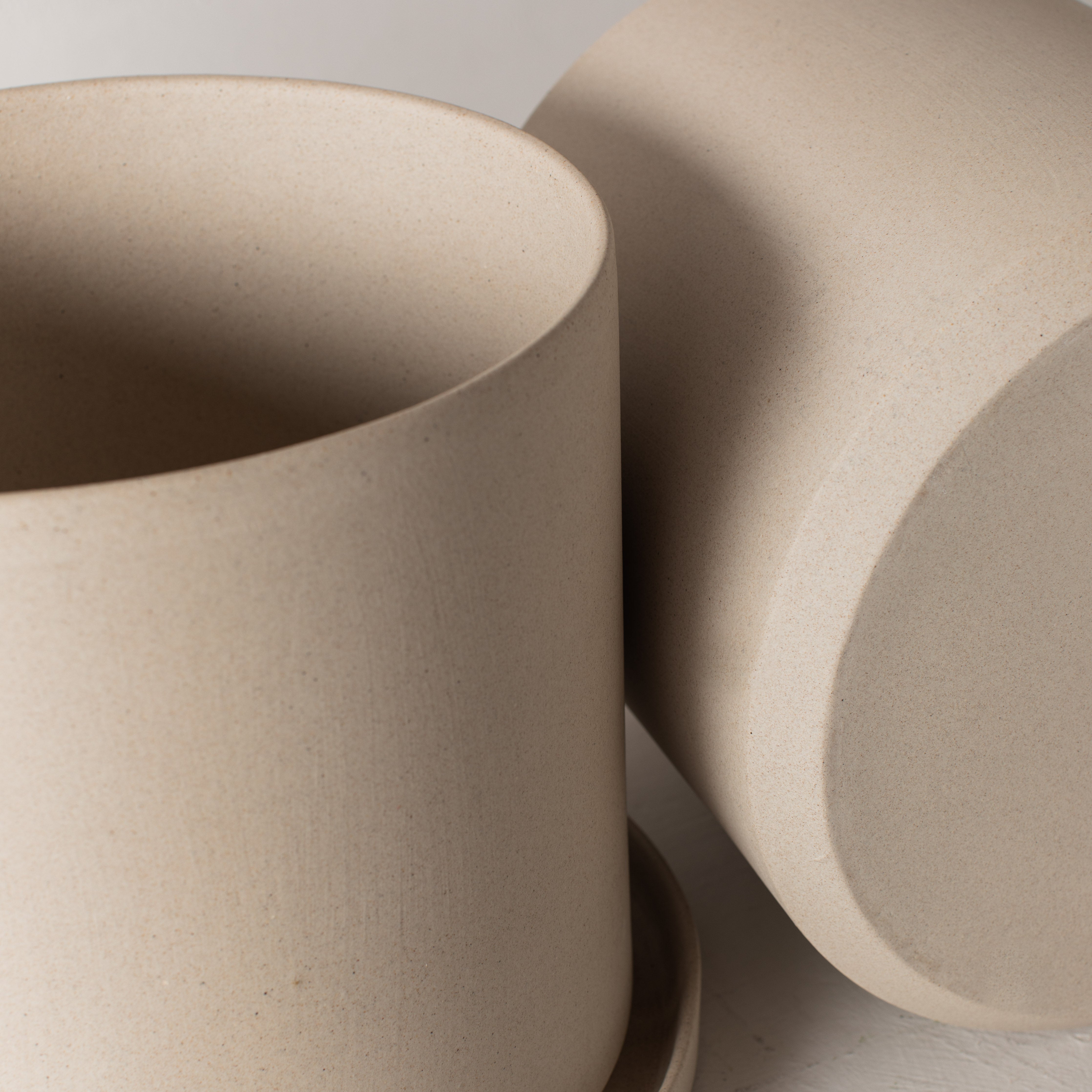 Close up of two 10 inch stoneware planters. Designed and sold by Convivial Production, Kansas City ceramics.