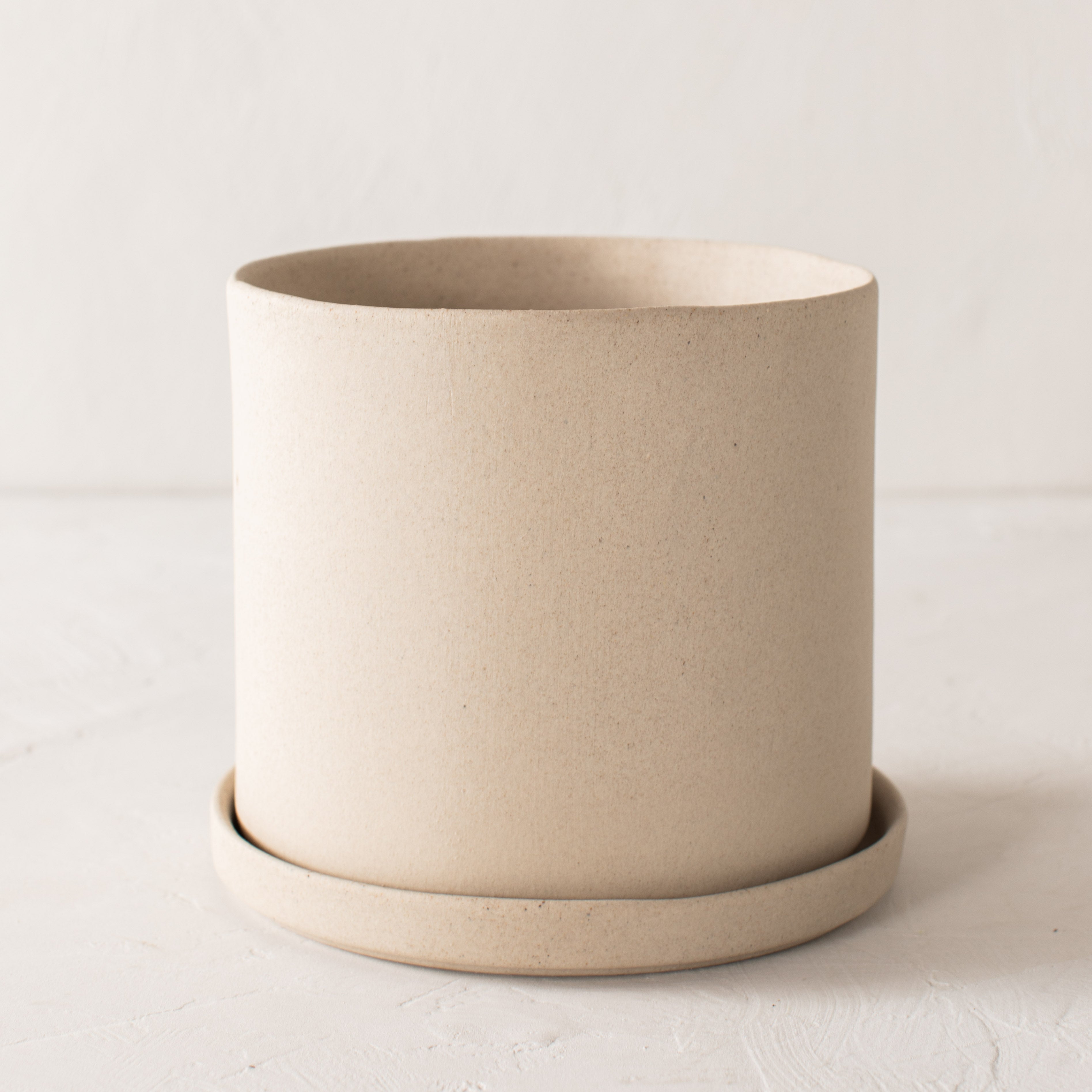 Stoneware minimal ceramic planter with bottom drainage dish. Handmade stoneware ceramic planter, designed and sold by Convivial Production, Kansas City ceramics.